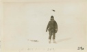 Image of Jot Small bringing in a white fox on a snowshoe